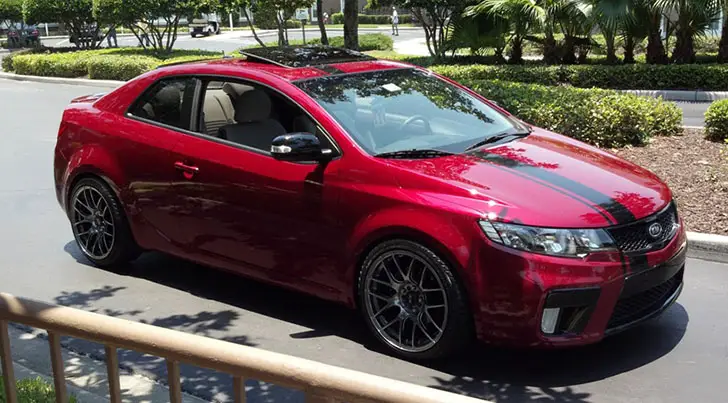 Spicy Red Kia Forte Koup EX With Dual Exhaust