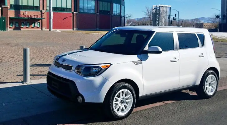 White Kia Soul with stripe