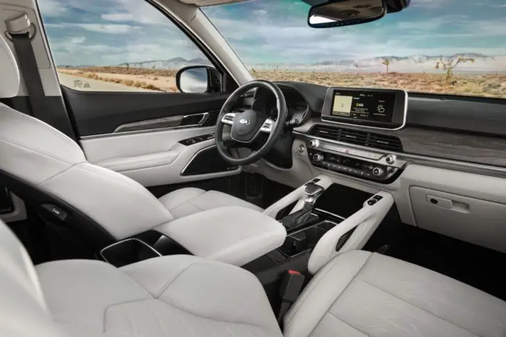 Kia Telluride SUV looks beautiful inside. The Nappa leather in white colors and wood trim look superb.